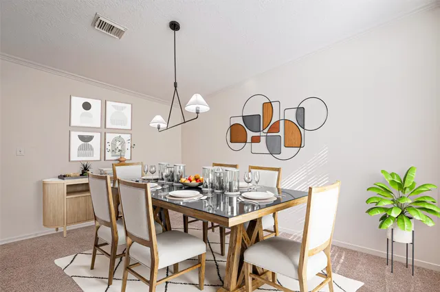a dining room with furniture a chandelier and window