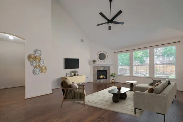 a living room with furniture or window and a fireplace