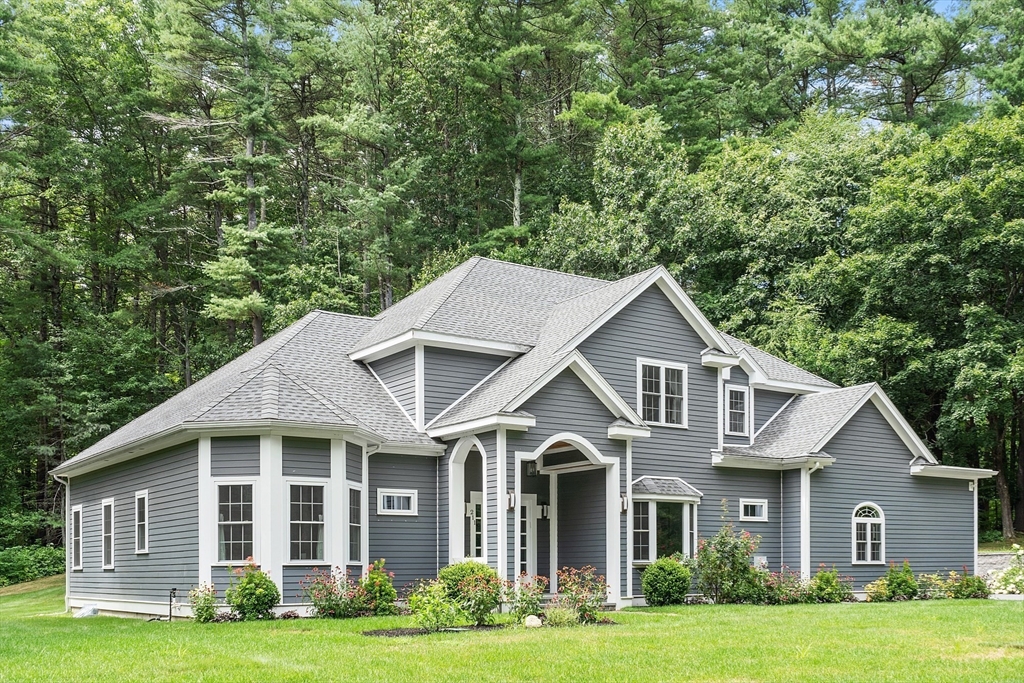 211 College Road Concord, MA 01742 - Photo 1 of 1 a front view of a house with a garden and trees