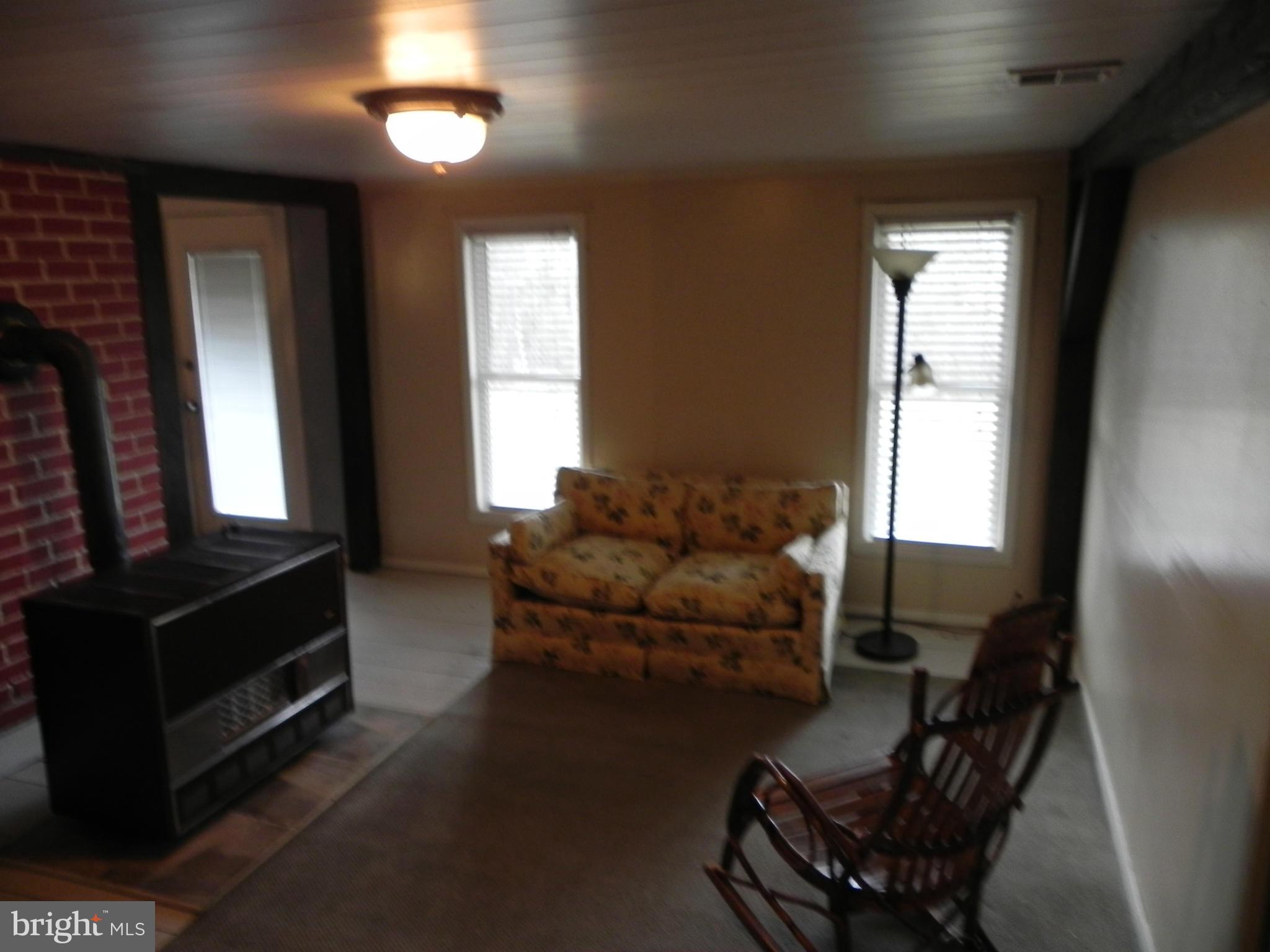 791 Pinetop Road Gore, VA 22637 - Photo 22 of 30 a living room with furniture and a window