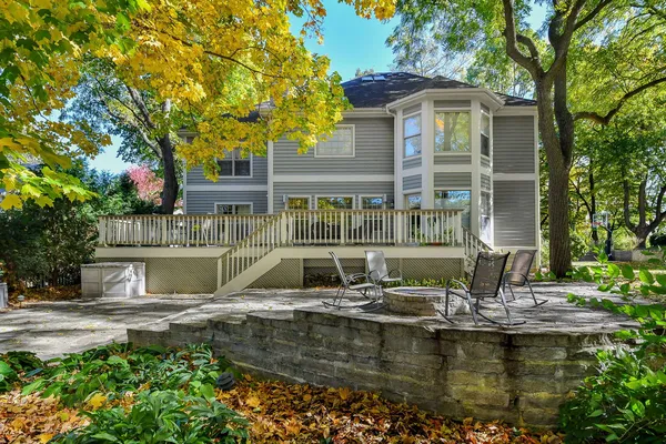 a front view of a house with swimming pool and porch