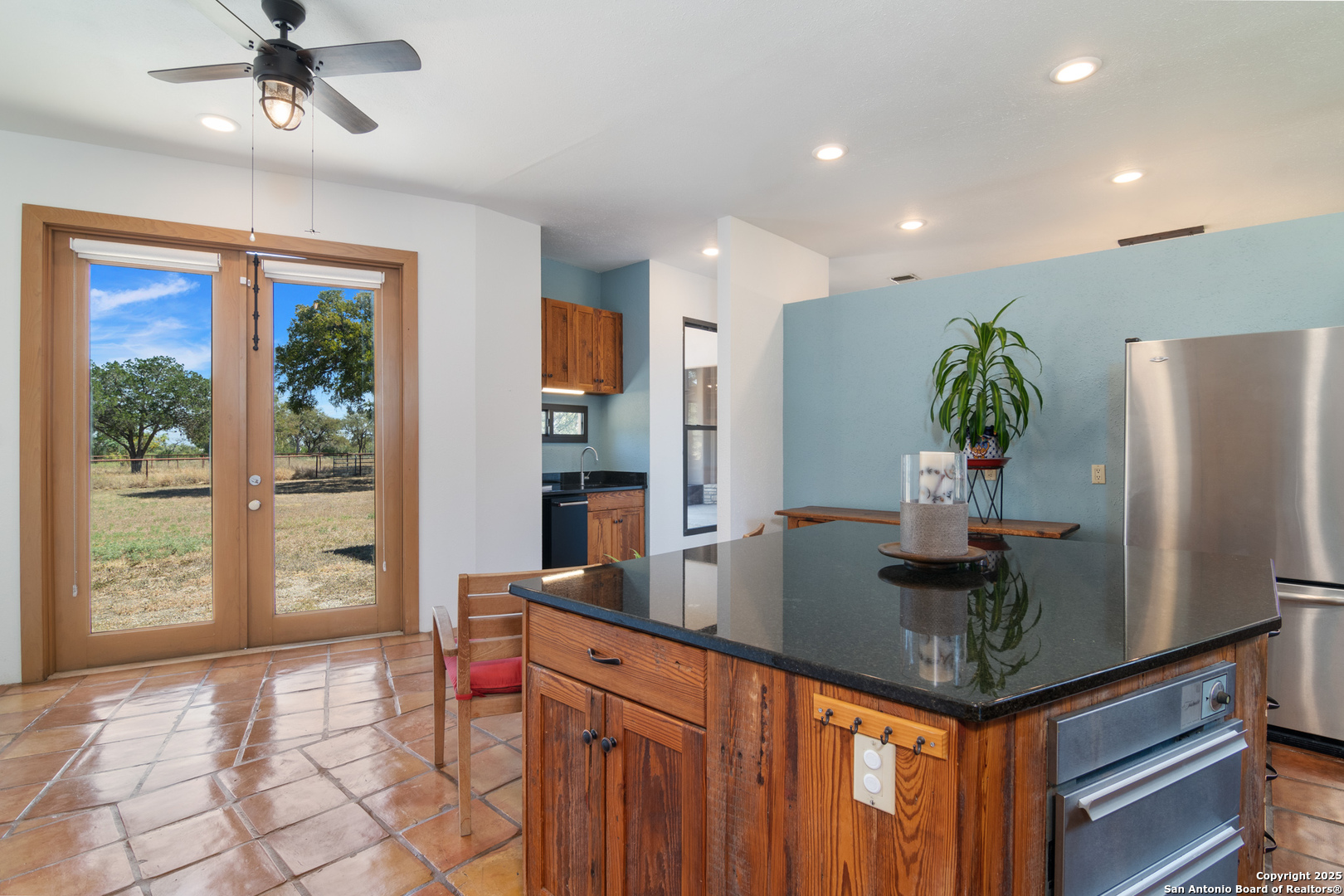 4025 Marion Road Marion, TX 78124 - Photo 11 of 60 a kitchen with stainless steel appliances granite countertop a refrigerator a sink and a stove