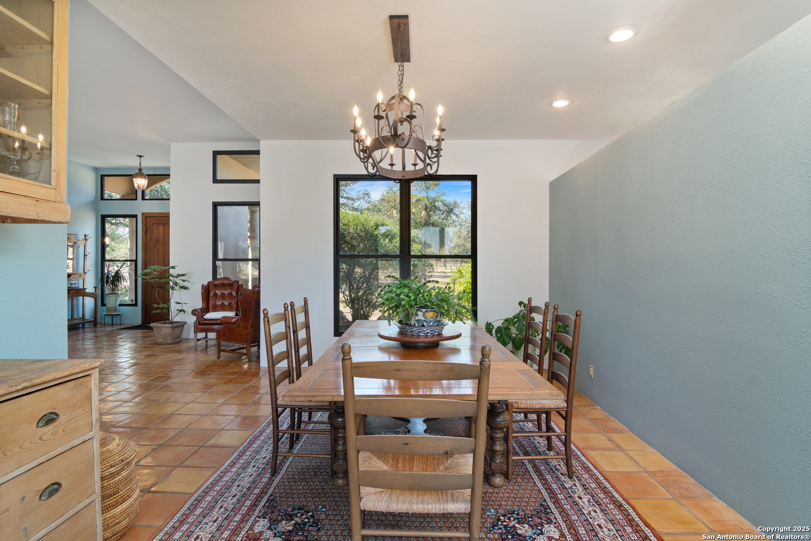 4025 Marion Road Marion, TX 78124 - Photo 12 of 60 a dining room with wooden floor a chandelier a glass table and chairs