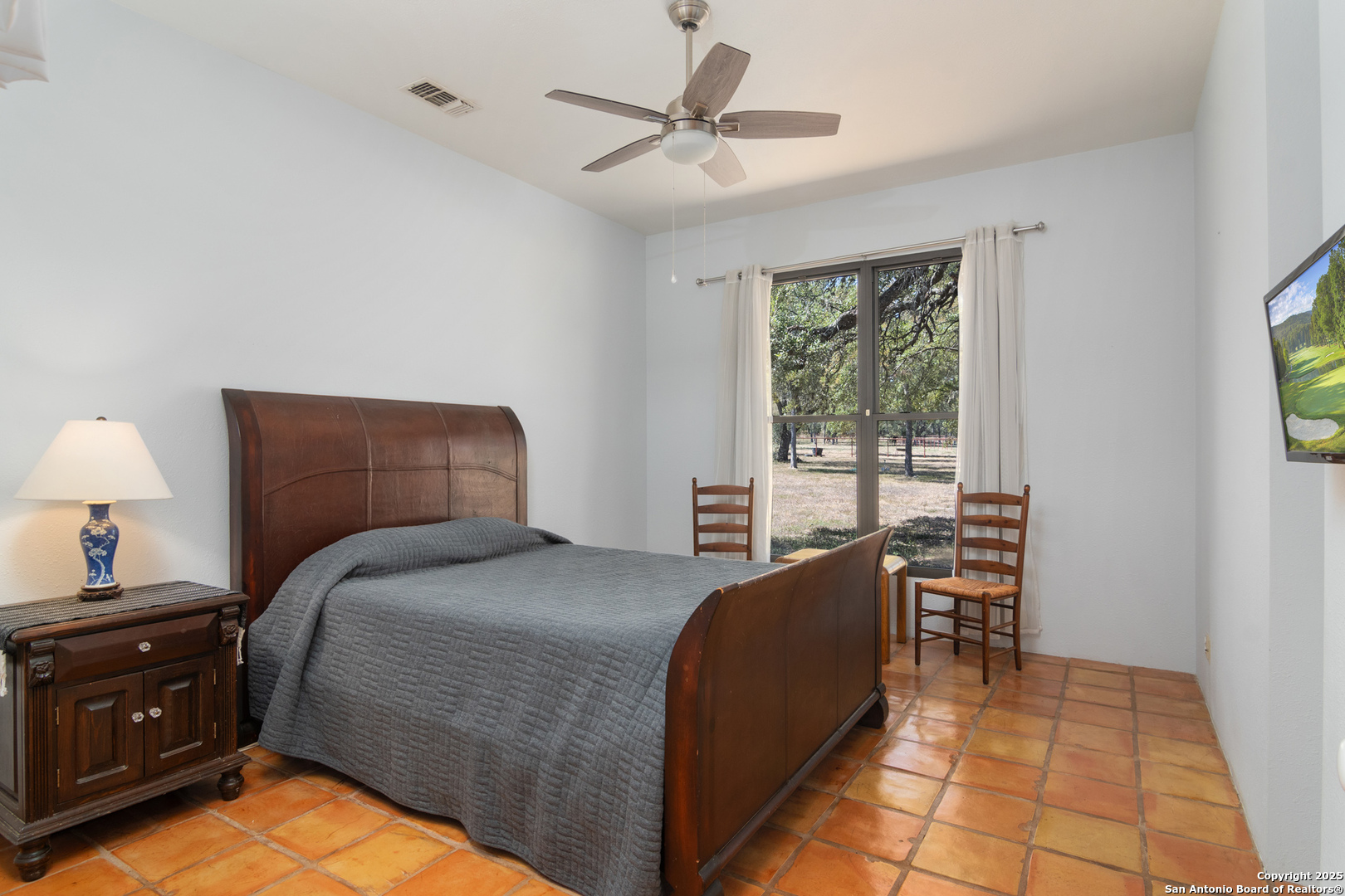 4025 Marion Road Marion, TX 78124 - Photo 14 of 60 a bed room with a bed and a chair