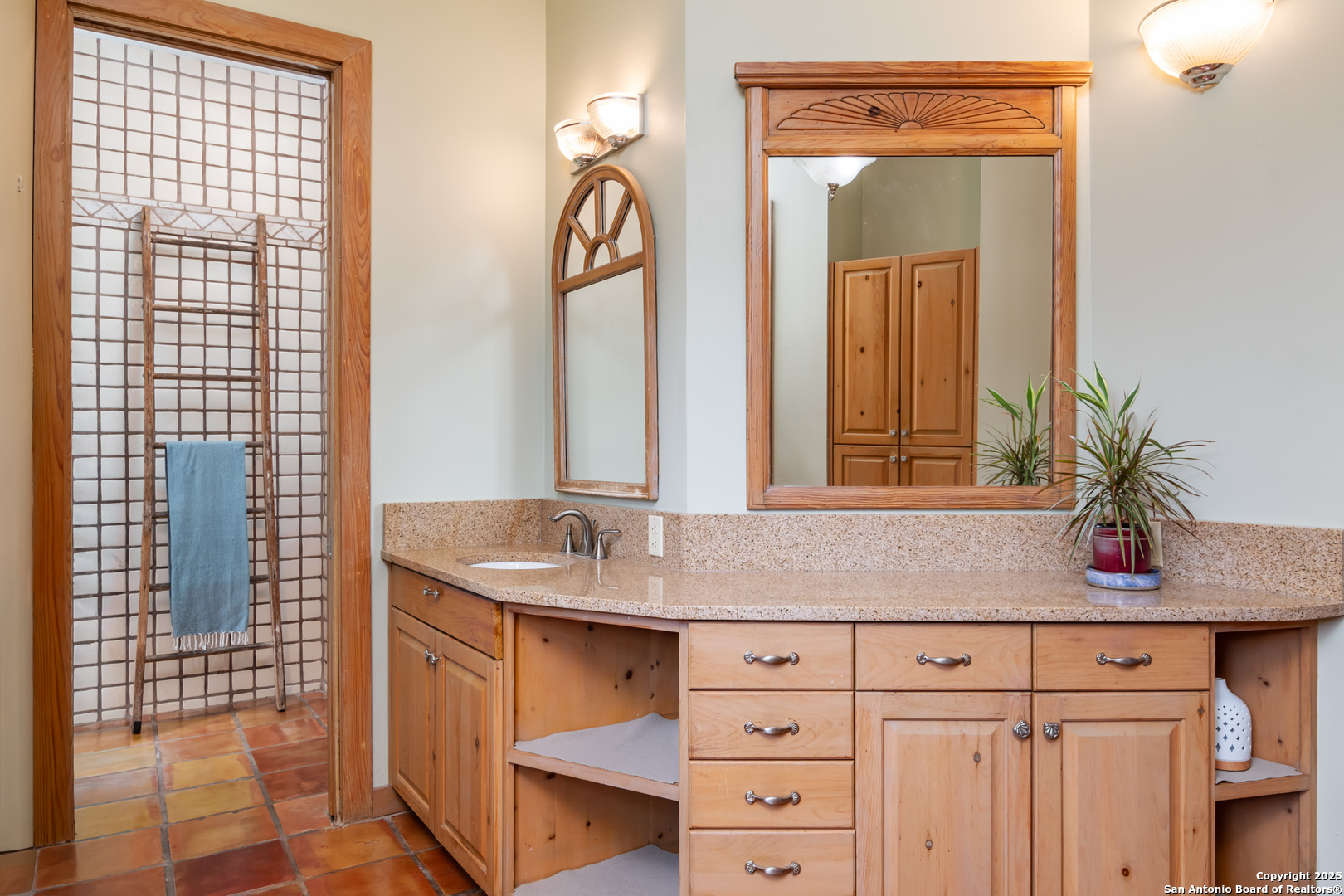 4025 Marion Road Marion, TX 78124 - Photo 17 of 60 a bathroom with a granite countertop sink and a mirror