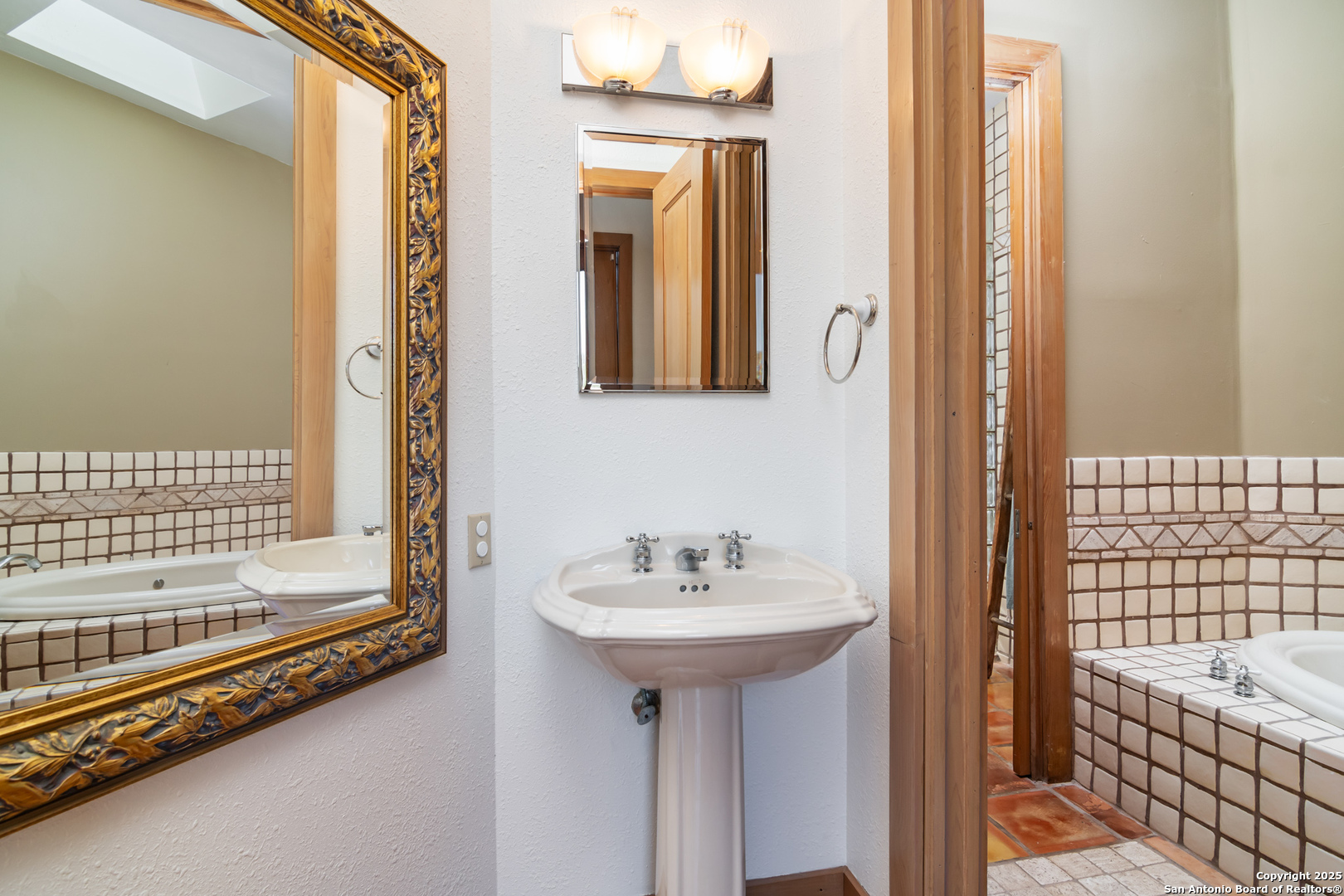 4025 Marion Road Marion, TX 78124 - Photo 21 of 60 a bathroom with a sink and a bathtub