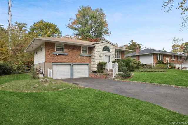 a view of a house with wooden fence and plants