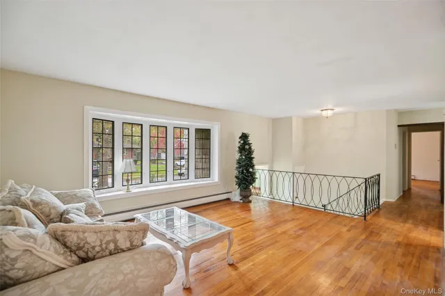a living room with furniture and a window with outer view