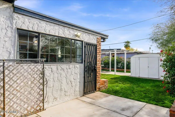 a view of a backyard with garden
