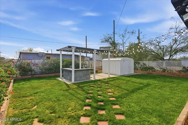a view of a porch with furniture and a yard