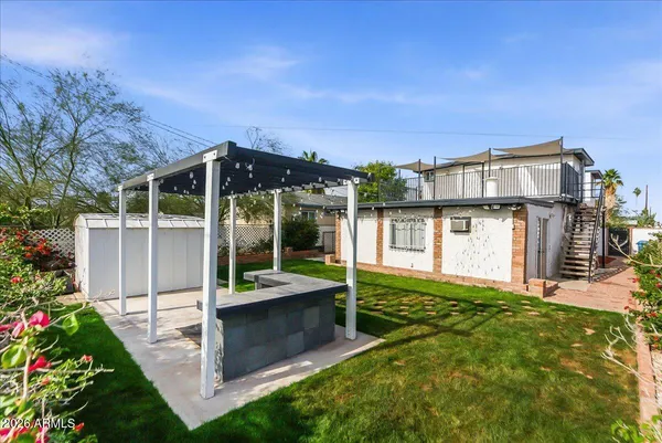 a patio with yard table and chairs