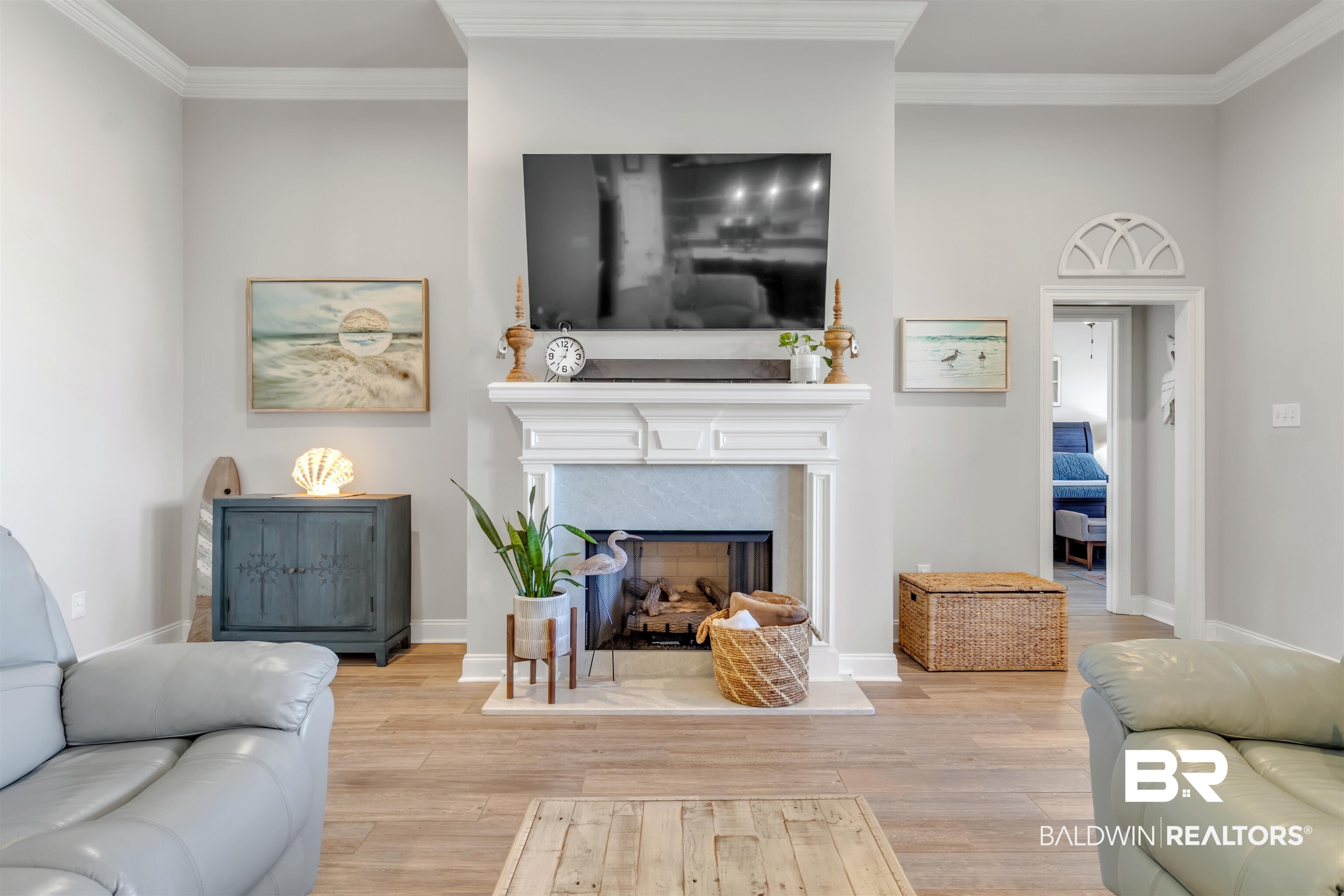 22531 Putter Lane Foley, AL 36535 - Photo 18 of 43 Living room with crown molding, light wood finished floors, and a fireplace