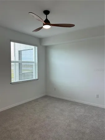 a bath tub sitting next to a white sink