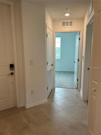 a view of a hallway with closet area