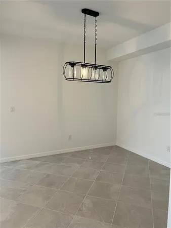 a view of a kitchen with a sink and cabinet