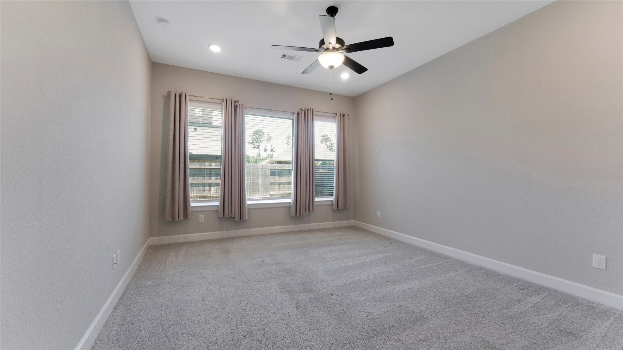 15607 Rising Wren Court Conroe, TX 77302 - Photo 18 of 40 wooden floor in an empty room with a window