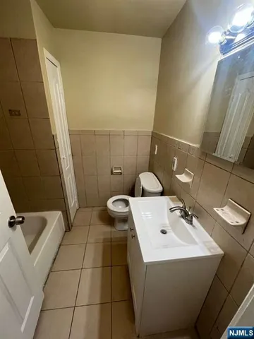 a view of an empty room and wooden floor