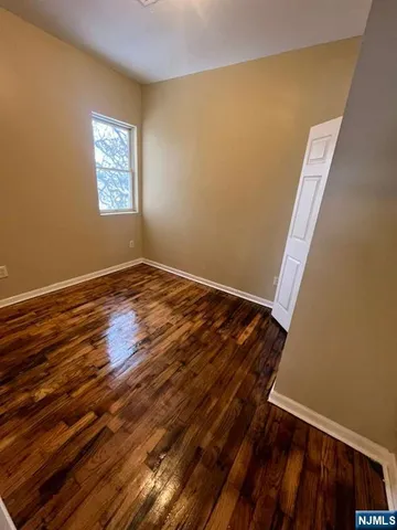 a kitchen with granite countertop a stove a sink and a microwave