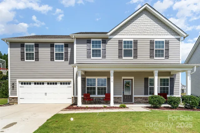 front view of a house with a yard