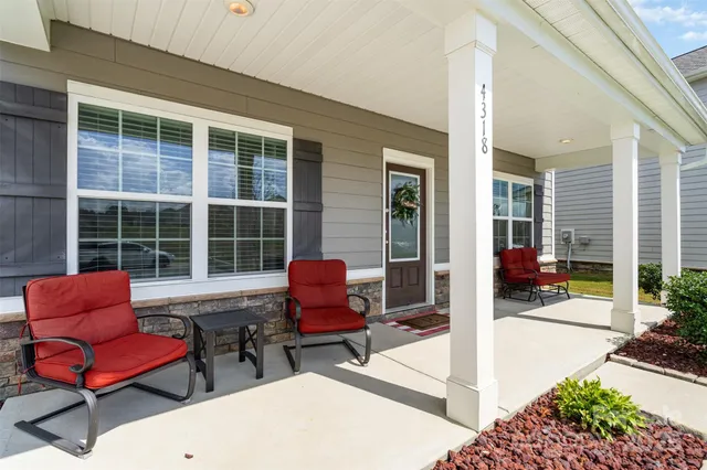 a workspace with furniture and a window