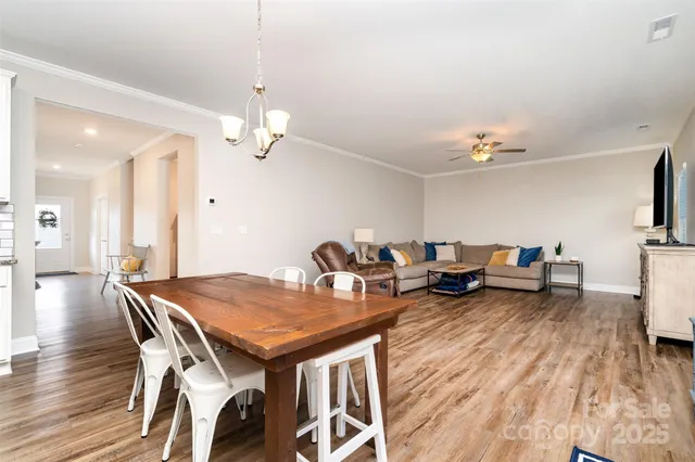 a kitchen with stainless steel appliances granite countertop a sink a stove a microwave and cabinets