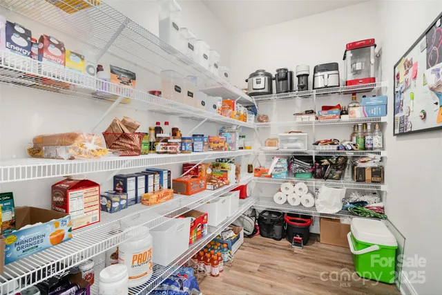 a view of a livingroom with furniture and a flat screen tv