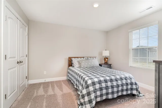 a view of a house with a yard and a house