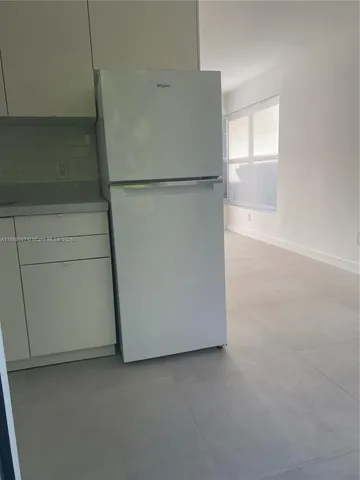 a view of a room that has a window in it