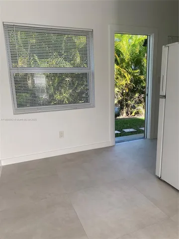 a kitchen with a stove and a refrigerator