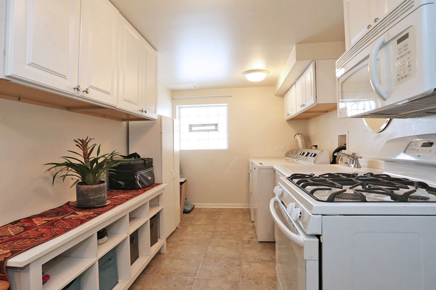 640 Edgemont Lane Hoffman Estates, IL 60169 - Photo 22 of 30 a kitchen with stainless steel appliances a stove a sink and cabinets