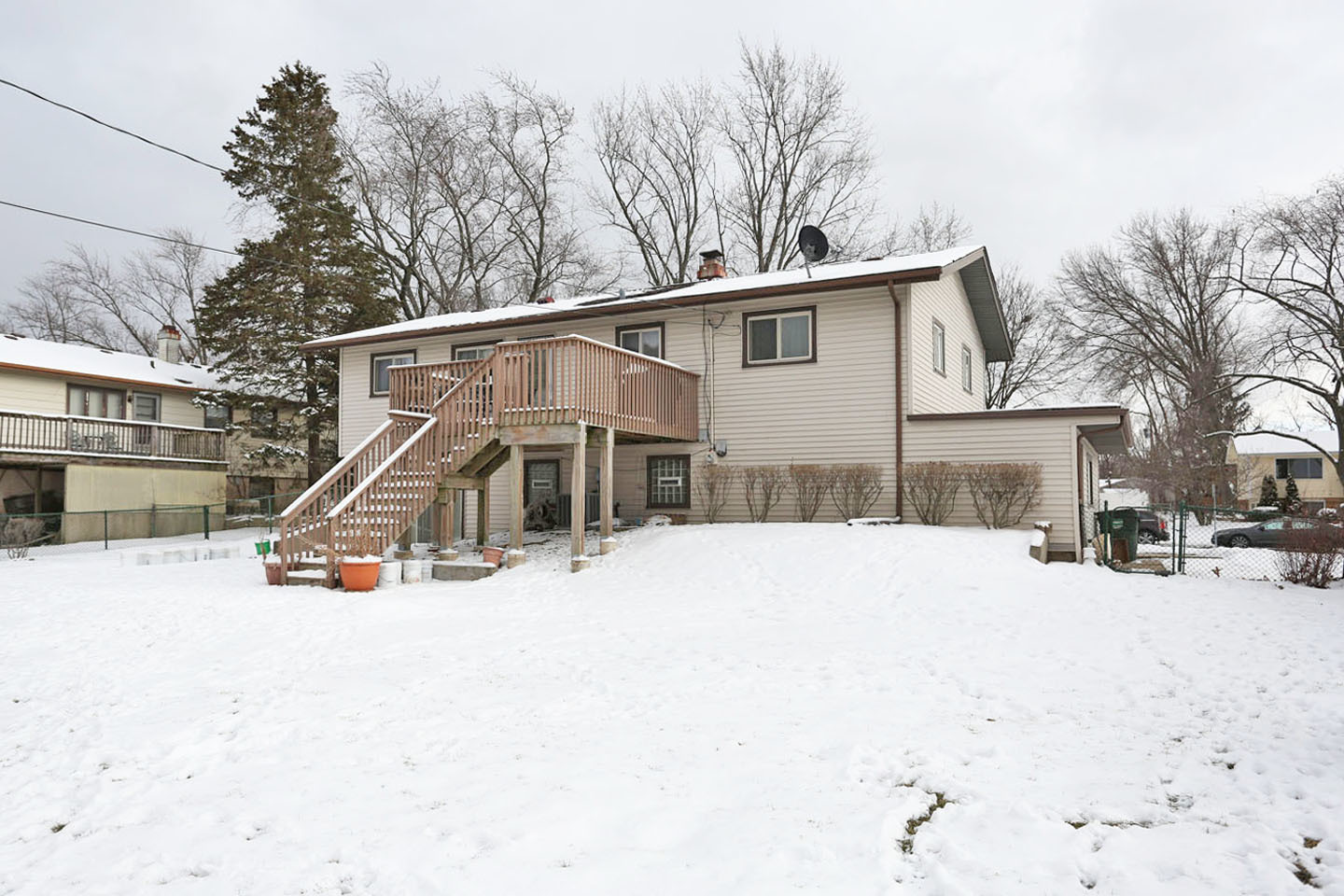 640 Edgemont Lane Hoffman Estates, IL 60169 - Photo 29 of 30 a view of a house with a snow in the yard
