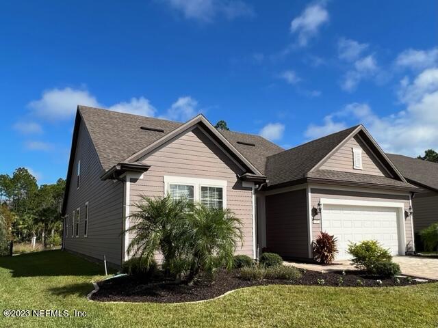 91 Broomsedge Circle St. Augustine, FL 32095 - Photo 1 of 45 a front view of a house with a yard