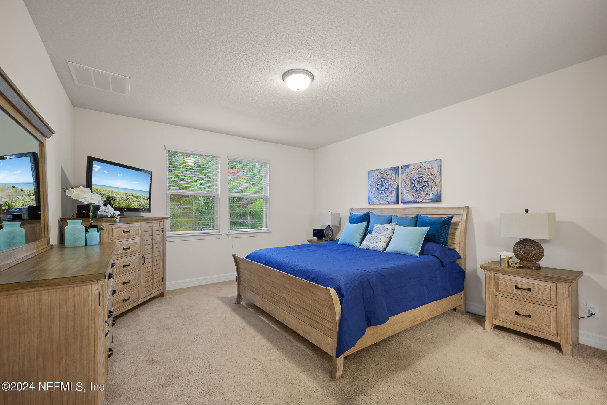 91 Broomsedge Circle St. Augustine, FL 32095 - Photo 17 of 45 a bed room with a bed and a window
