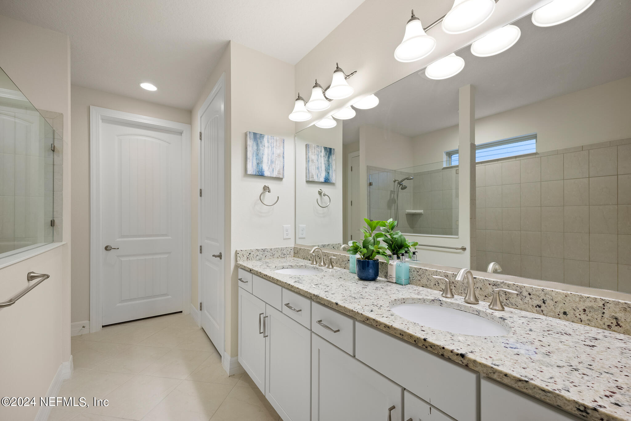 91 Broomsedge Circle St. Augustine, FL 32095 - Photo 19 of 45 a bathroom with a granite countertop double vanity sink and a mirror
