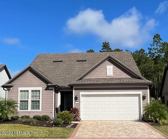 91 Broomsedge Circle St. Augustine, FL 32095 - Photo 2 of 45 a front view of a house with a yard