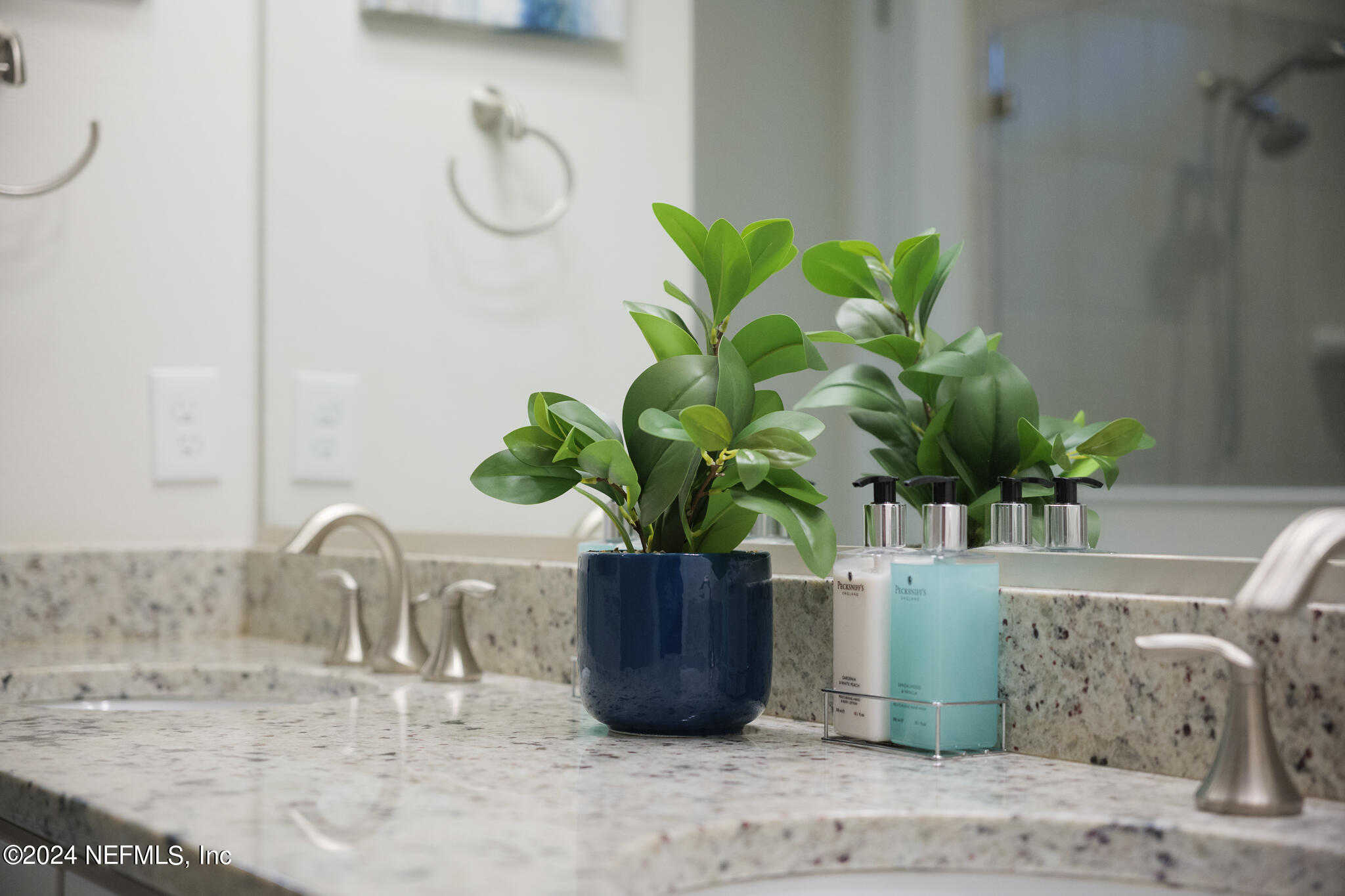 91 Broomsedge Circle St. Augustine, FL 32095 - Photo 21 of 45 a view of a vase of flowers sitting on a table