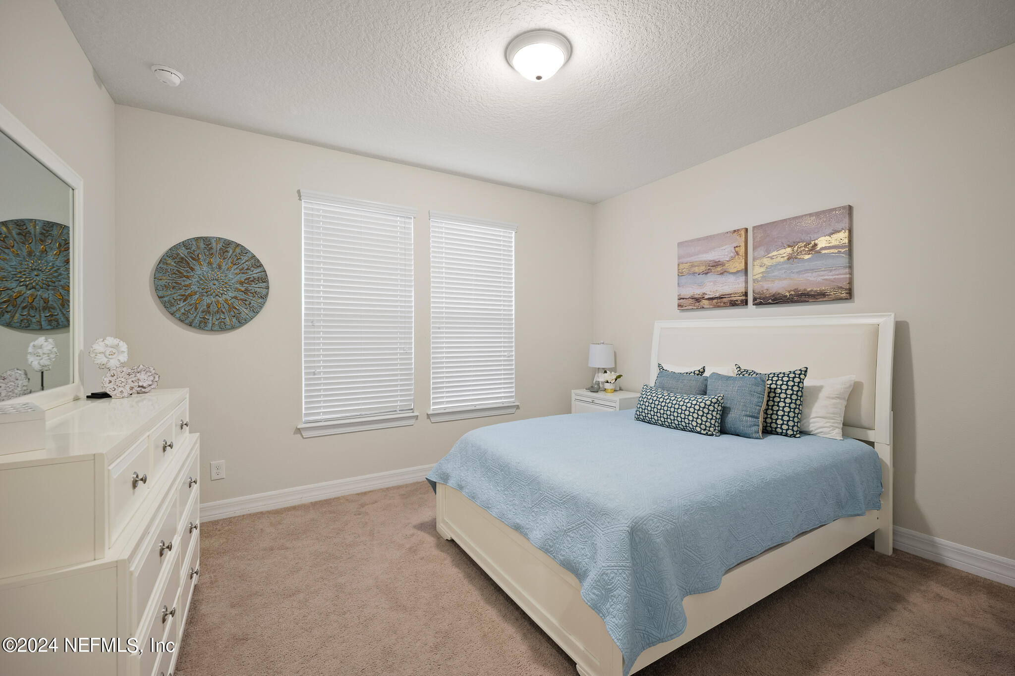 91 Broomsedge Circle St. Augustine, FL 32095 - Photo 22 of 45 a bedroom with a bed and a window