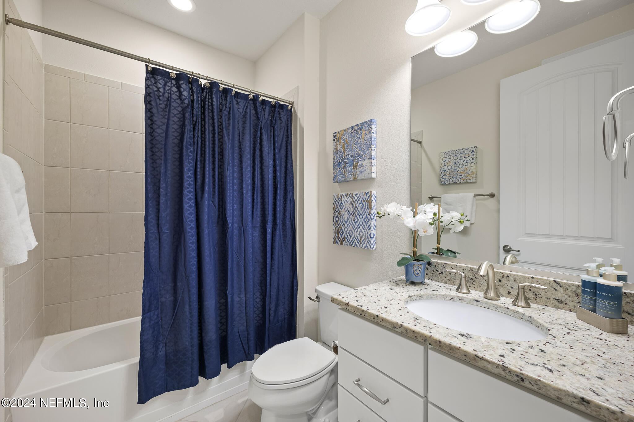 91 Broomsedge Circle St. Augustine, FL 32095 - Photo 24 of 45 a bathroom with a granite countertop sink toilet and shower