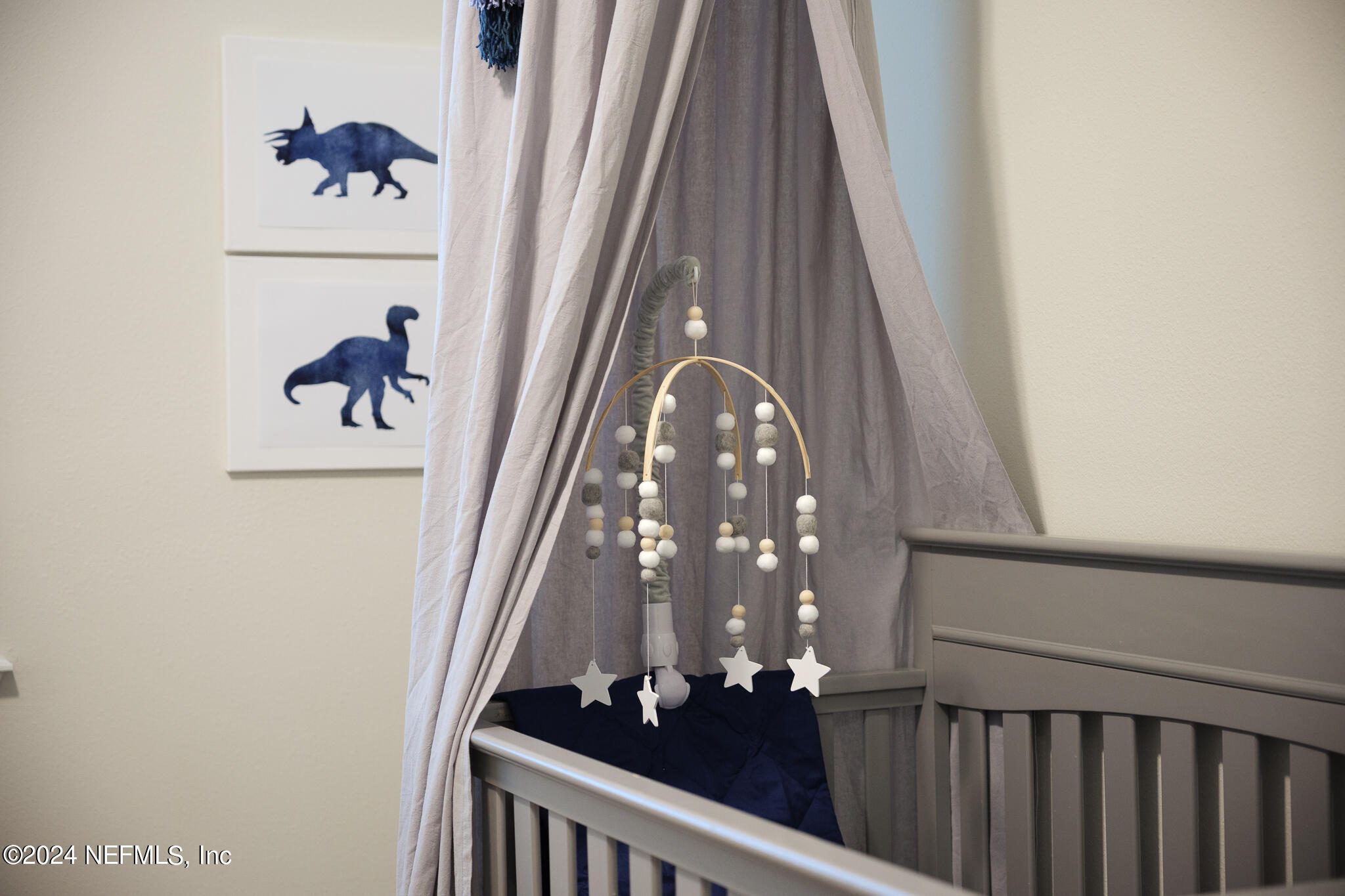 91 Broomsedge Circle St. Augustine, FL 32095 - Photo 25 of 45 a view of staircase with railing and a chandelier
