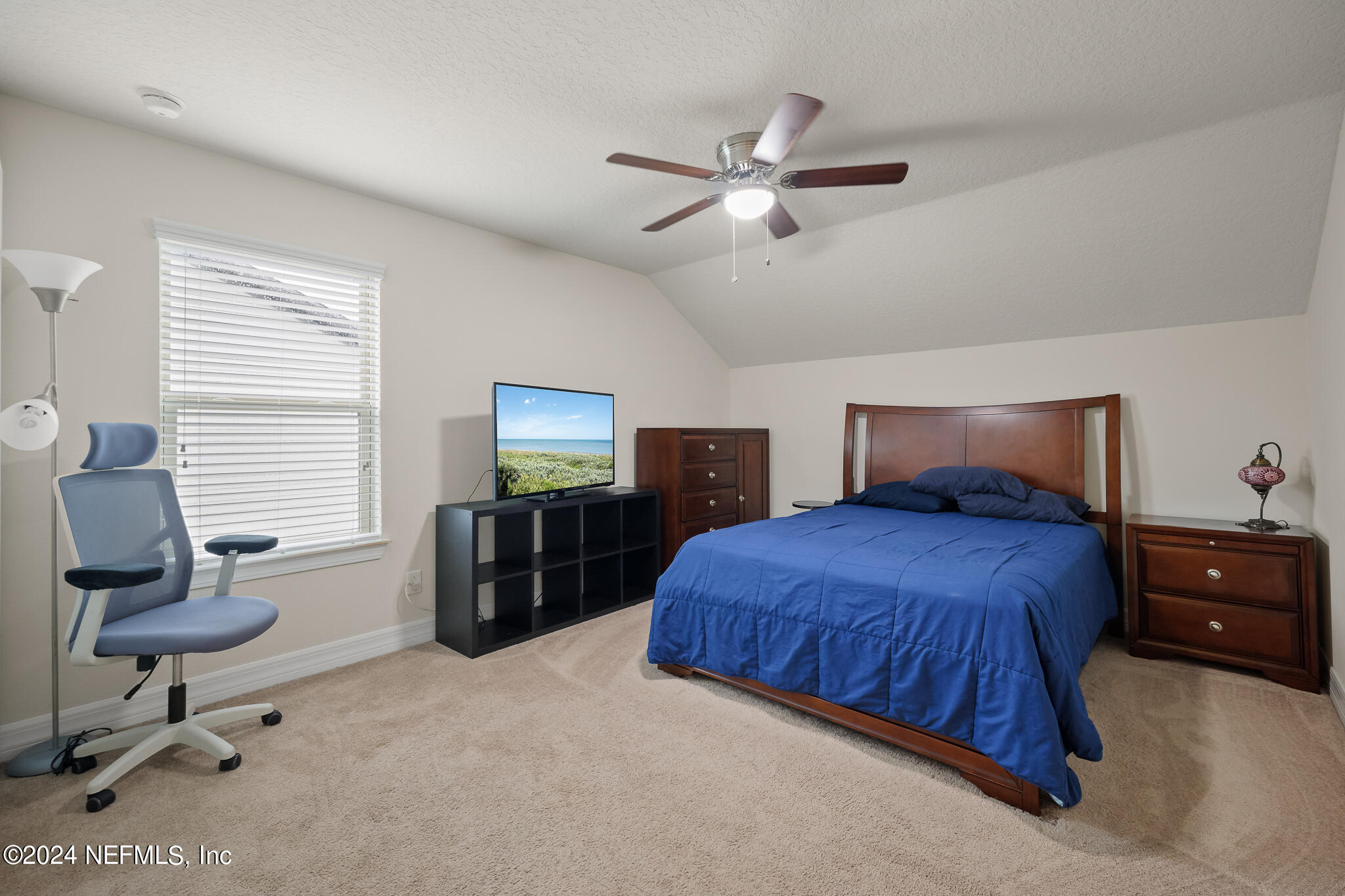 91 Broomsedge Circle St. Augustine, FL 32095 - Photo 29 of 45 a bedroom with a bed and furniture