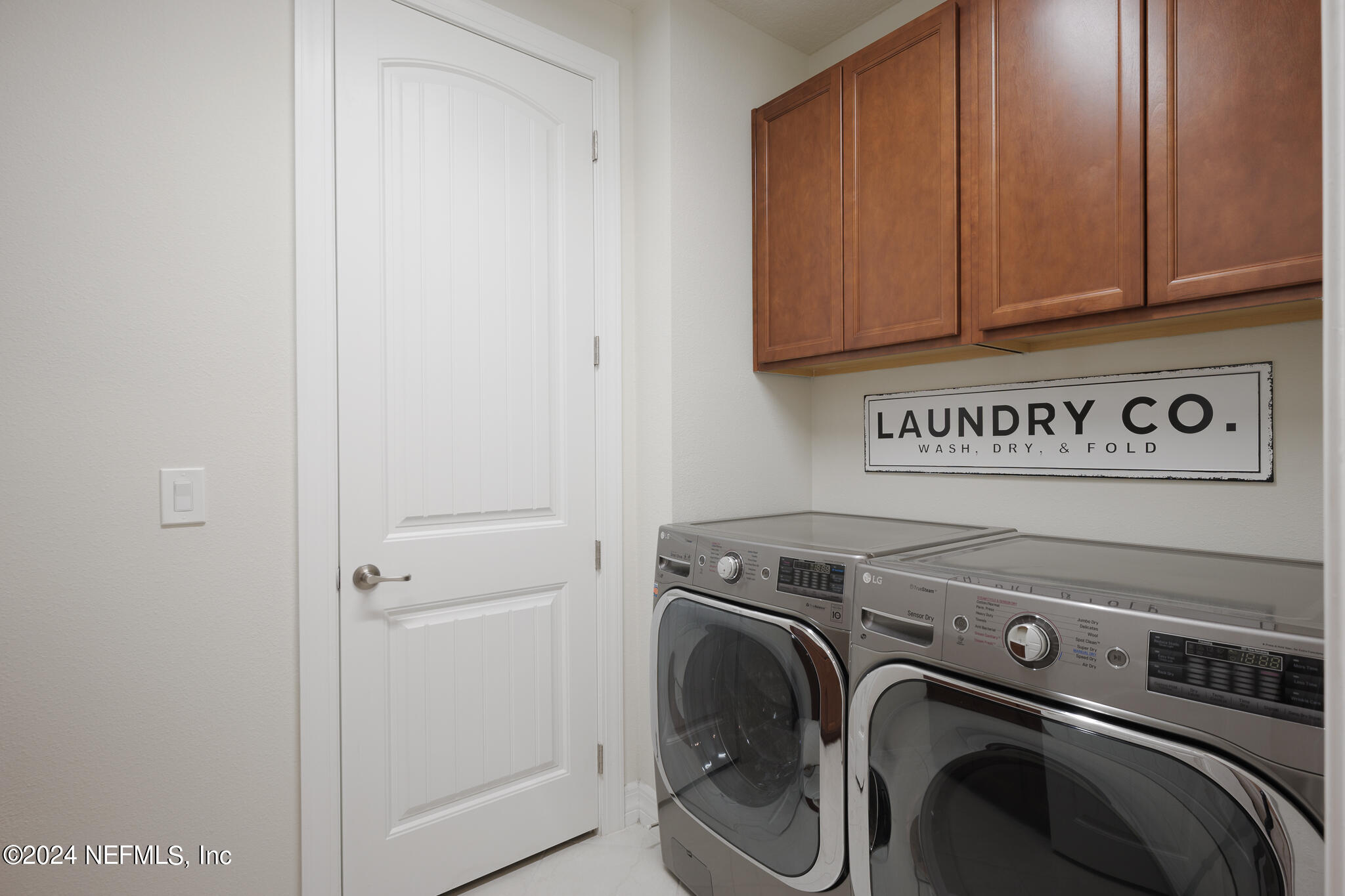 91 Broomsedge Circle St. Augustine, FL 32095 - Photo 34 of 45 a utility room with dryer and washer