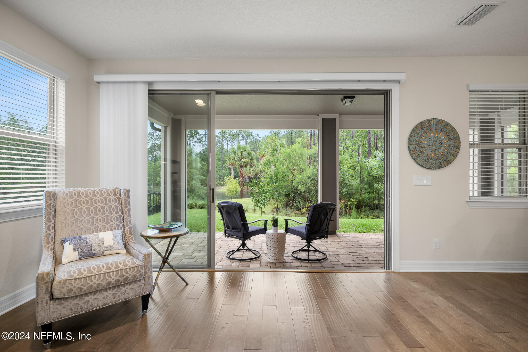 91 Broomsedge Circle St. Augustine, FL 32095 - Photo 36 of 45 a living room with furniture and a large window