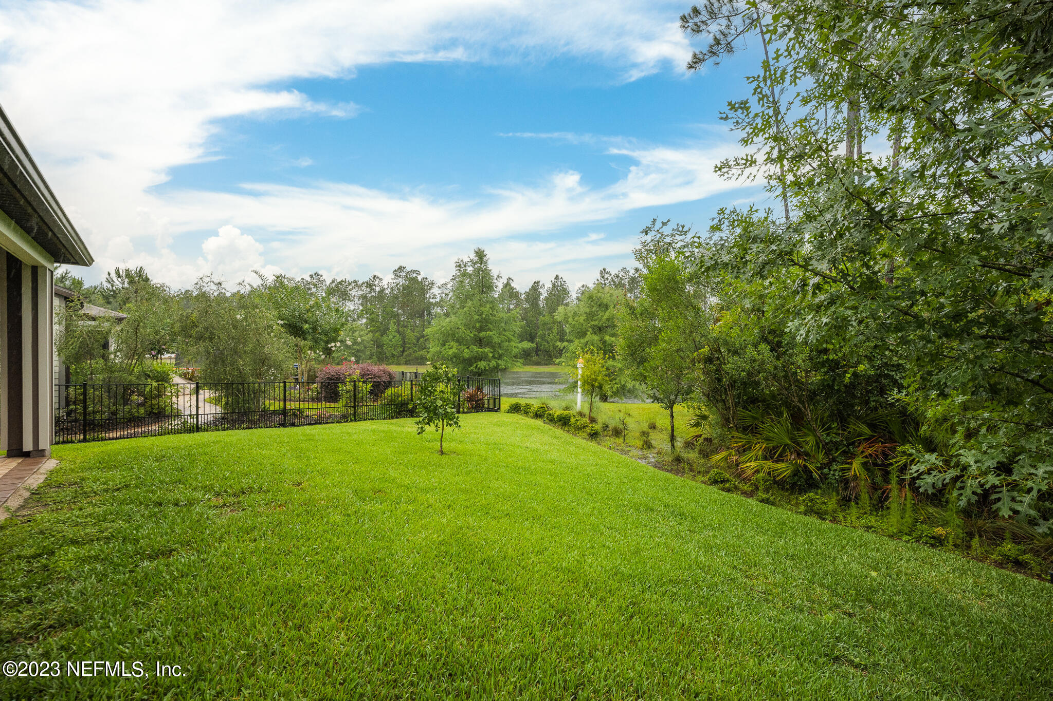 91 Broomsedge Circle St. Augustine, FL 32095 - Photo 37 of 45 a view of an outdoor space and a yard