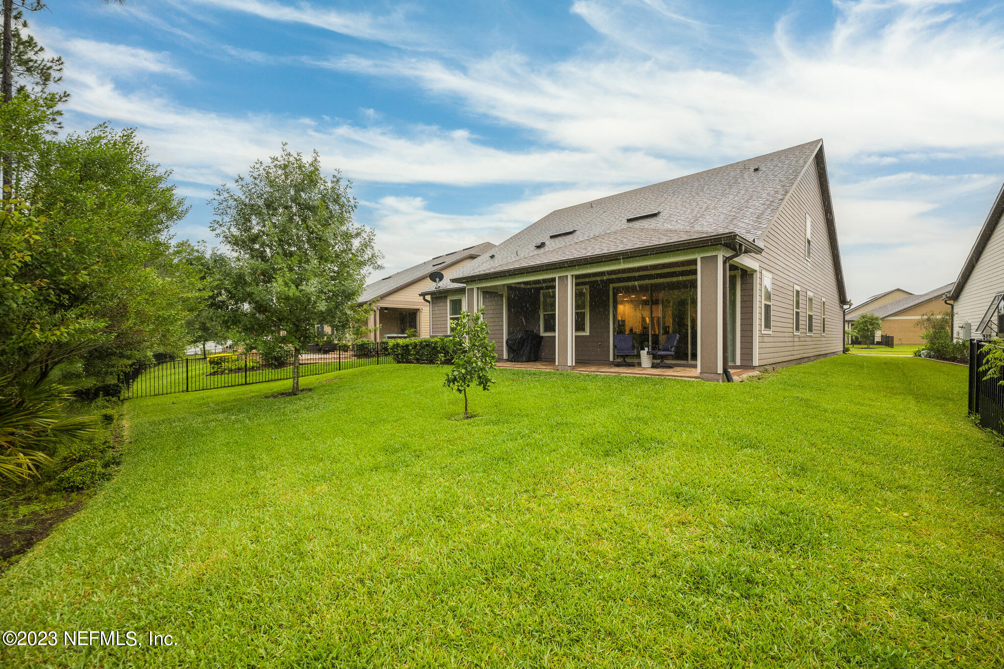 91 Broomsedge Circle St. Augustine, FL 32095 - Photo 38 of 45 a view of a house with a backyard