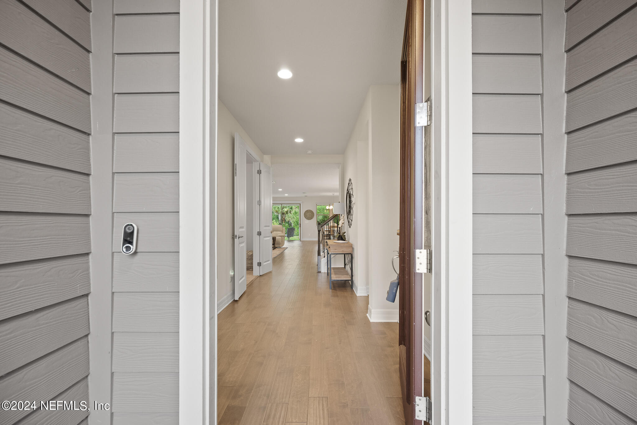 91 Broomsedge Circle St. Augustine, FL 32095 - Photo 4 of 45 a view of a hallway with wooden shelves