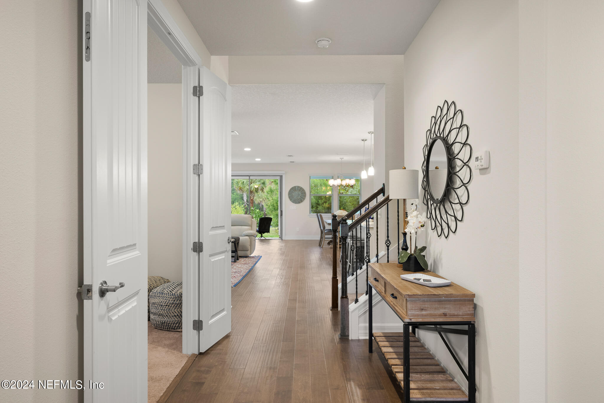 91 Broomsedge Circle St. Augustine, FL 32095 - Photo 5 of 45 a livingroom with wooden floor and a potted plant