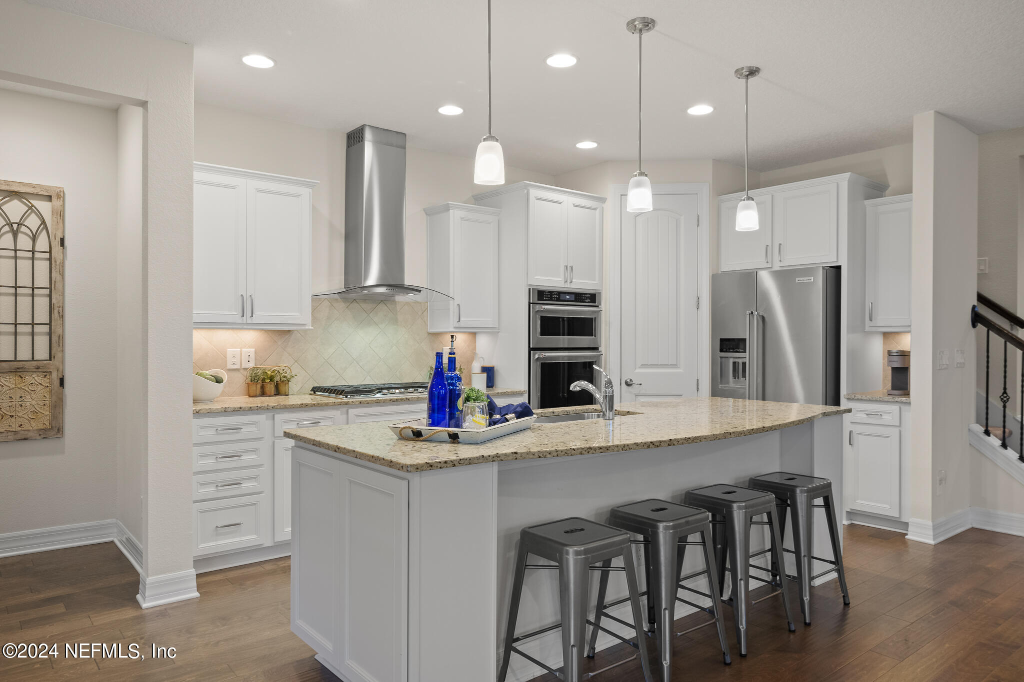 91 Broomsedge Circle St. Augustine, FL 32095 - Photo 8 of 45 a kitchen that has a lot of cabinets a sink and appliances in it