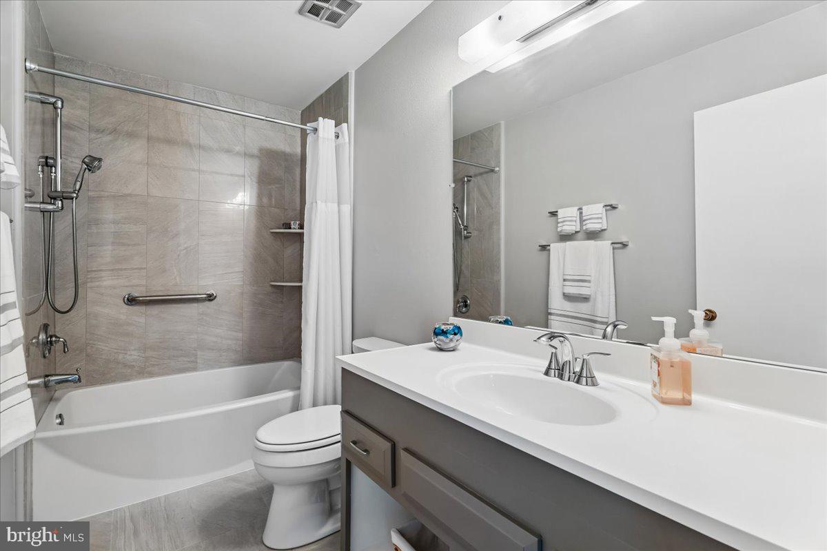 14515 Fiske Drive, Unit 160A Silver Spring, MD 20906 - Photo 15 of 20 a bathroom with a sink a toilet and a bathtub
