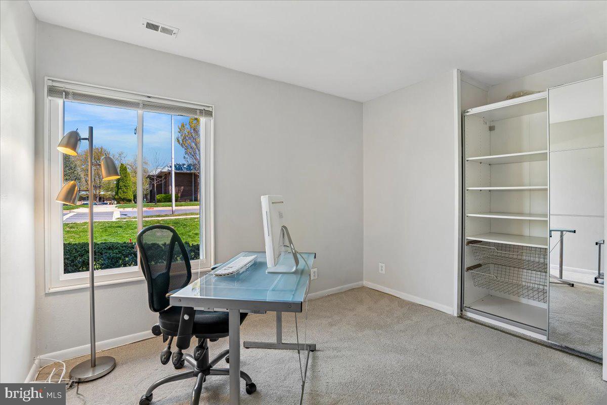 14515 Fiske Drive, Unit 160A Silver Spring, MD 20906 - Photo 16 of 20 a view of a workspace with furniture and a window