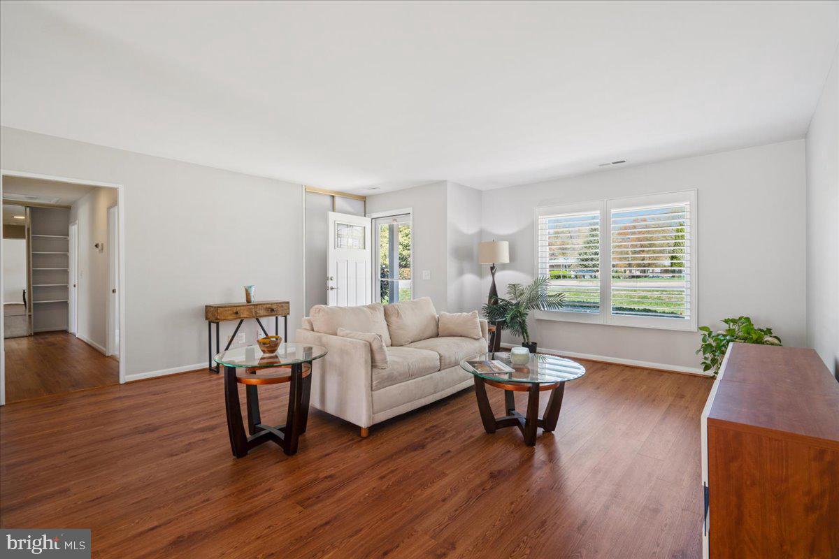 14515 Fiske Drive, Unit 160A Silver Spring, MD 20906 - Photo 2 of 20 a living room with furniture and a wooden floor